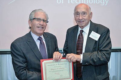 Ben D’Armiento ’48 (right) accepts his Cornerstone Society membership certificate from NJIT President Joel S. Bloom